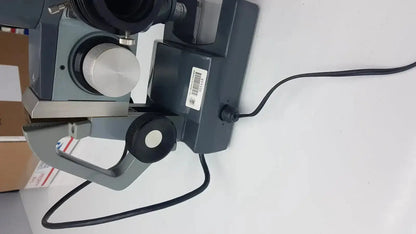 Gray and black metal American Optical AO micro star microscope k-2301 with silver focusing knob for precision viewing