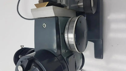 Black industrial rotary dial with silver刻度 markings and brass component on american optical optical ao micro star microscope k-2301