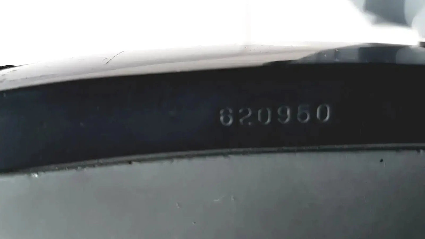 Black plastic trim with engraved serial number 620950 on american optical spencer microscope back panel