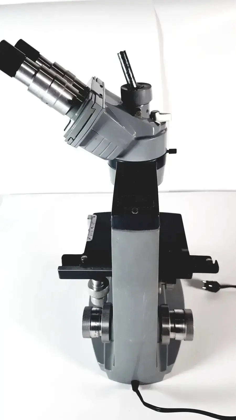 Gray and black american optical spencer microscope with metallic components for precise optical analysis and research use