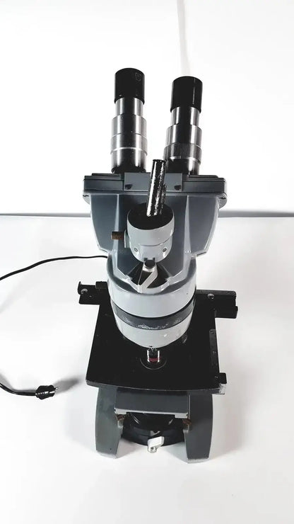 American Optical Spencer compound microscope in black and silver with dual eyepieces and adjustable stage