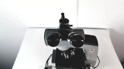 Black and silver american optical spencer compound microscope with dual eyepieces and sturdy base for precision use
