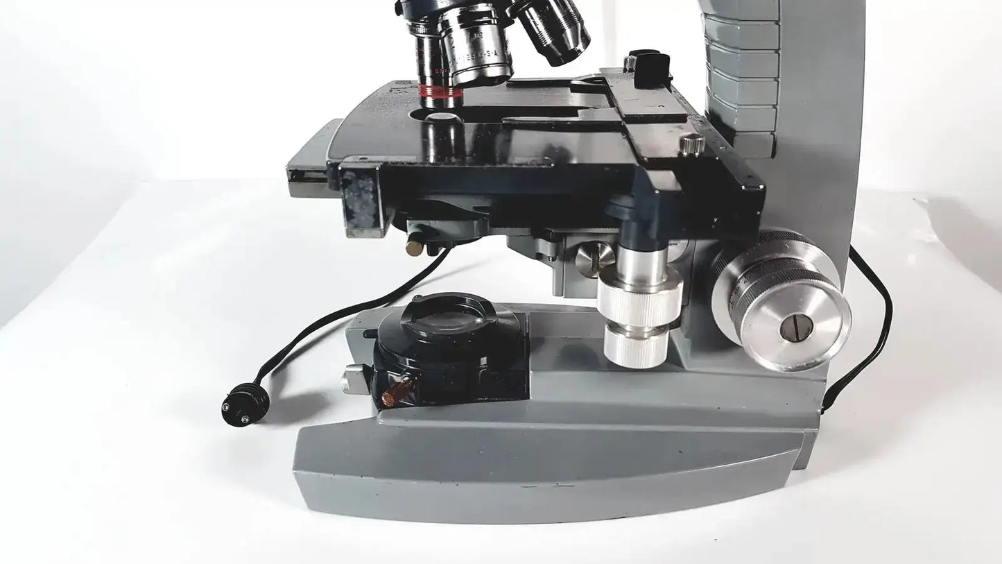 Gray and black american optical spencer microscope with metallic components for precise laboratory use