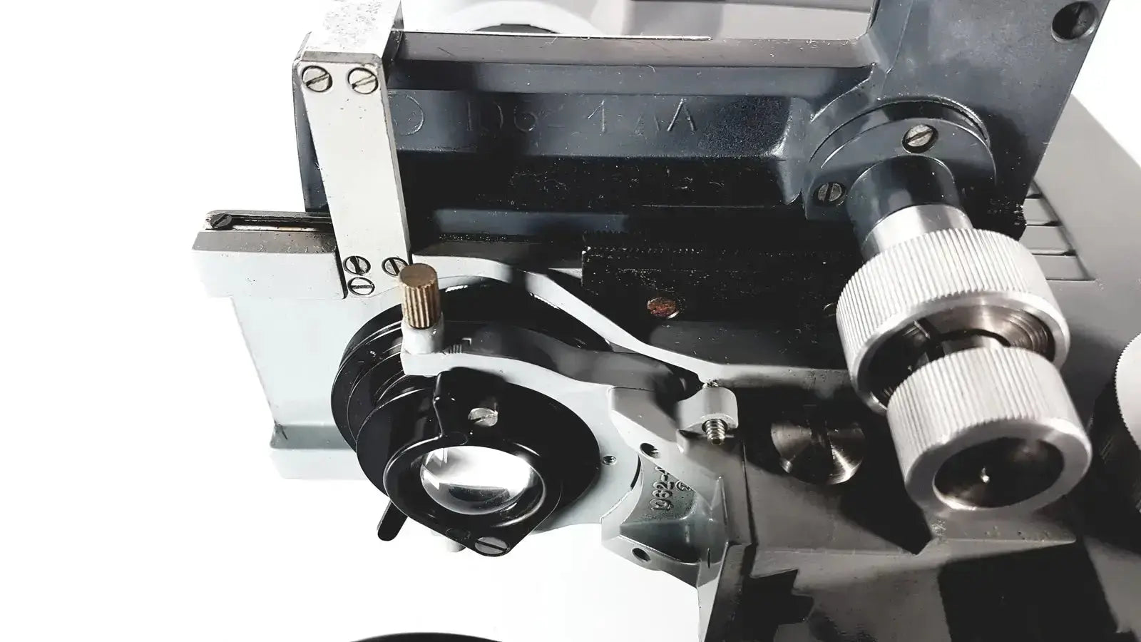 Black and silver metal american optical spencer microscope with adjustable focus knobs and precision components