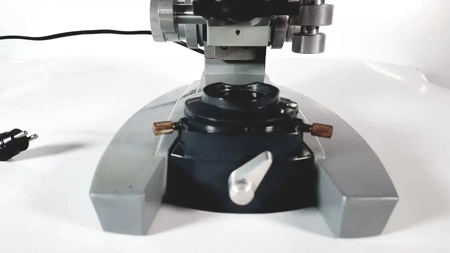 Silver and black metal american optical spencer microscope with adjustable focus knobs for precise optical use
