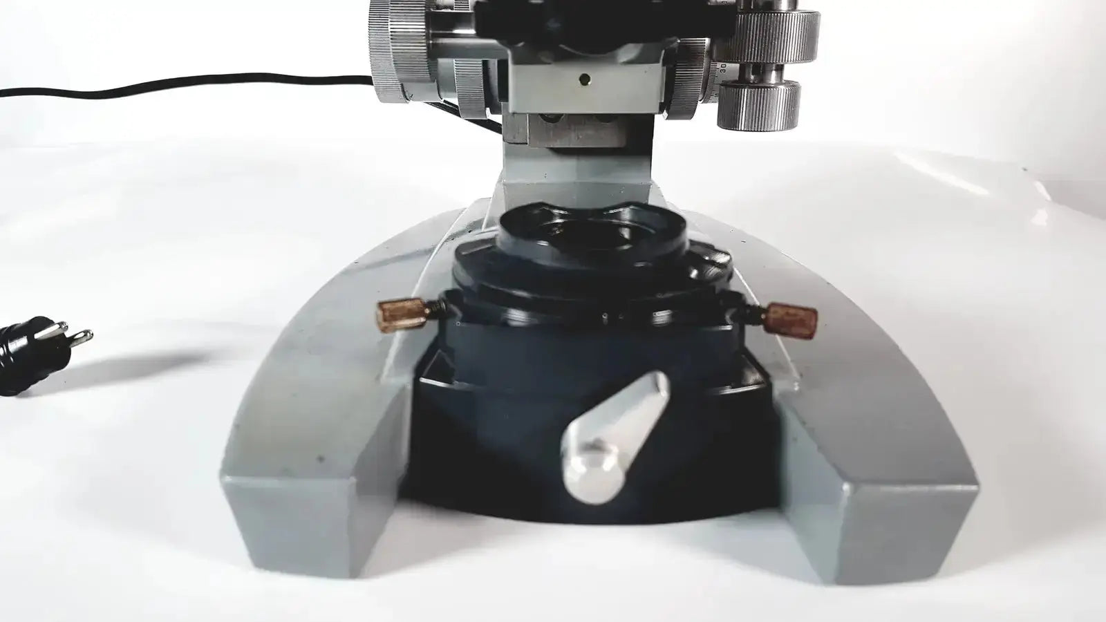 Silver and black metal american optical spencer microscope with adjustable focus knobs for precise optical use