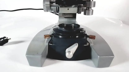 Silver and black metal american optical spencer microscope with adjustable focus knobs for precise optical use