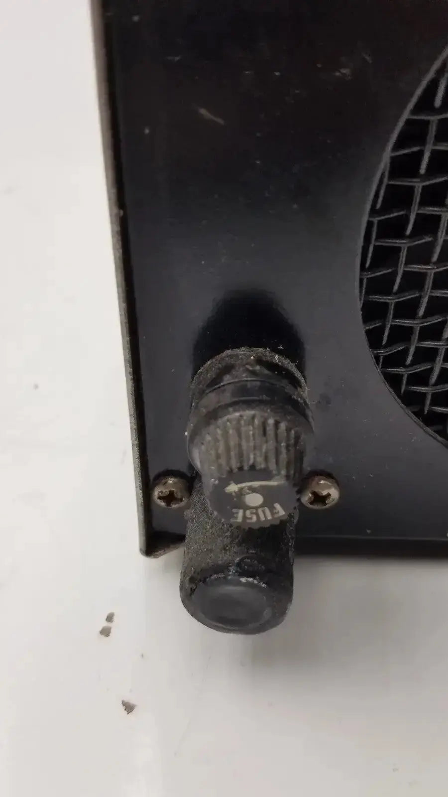 Black plastic fuse holder with textured grip and fuse label for amicon model lp-1 peristaltic pump system
