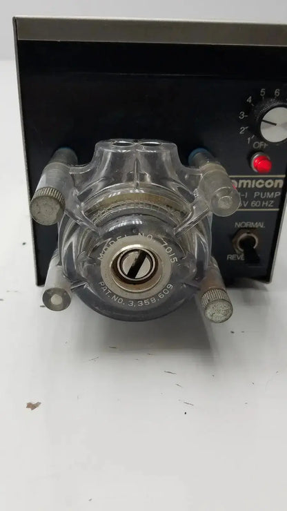 Clear plastic lp-1 peristaltic pump with metallic fittings and black comicon control panel for precise fluid handling