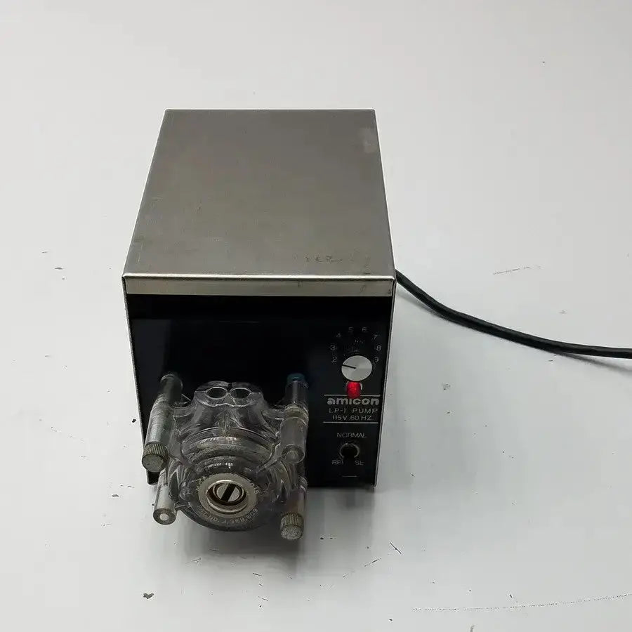 Silver and black amicon model lp-1 peristaltic pump with transparent tubing fittings and cole parmer pump heads 7015