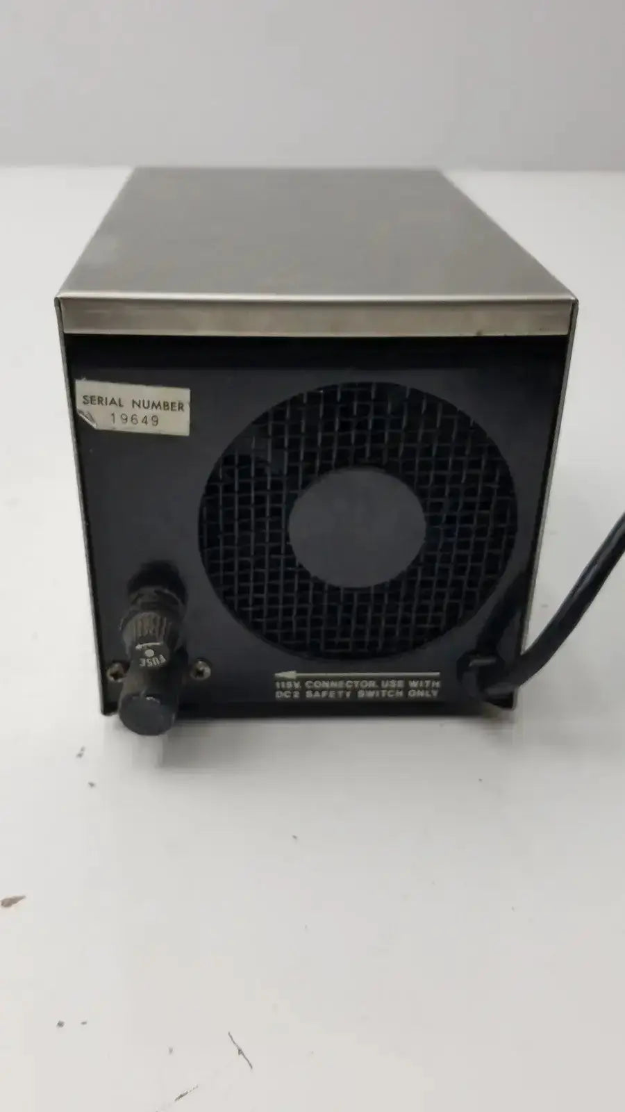 Black and silver metal lp-1 peristaltic pump back side with circular vent grille knob control and serial number 19649 label