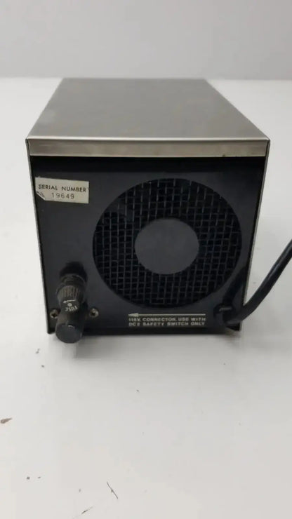 Black and silver metal lp-1 peristaltic pump back side with circular vent grille knob control and serial number 19649 label