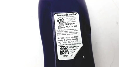Dark blue anacom medtek b0857-088dj oxygen delivery device with white label showing model and serial info for nurse call unit