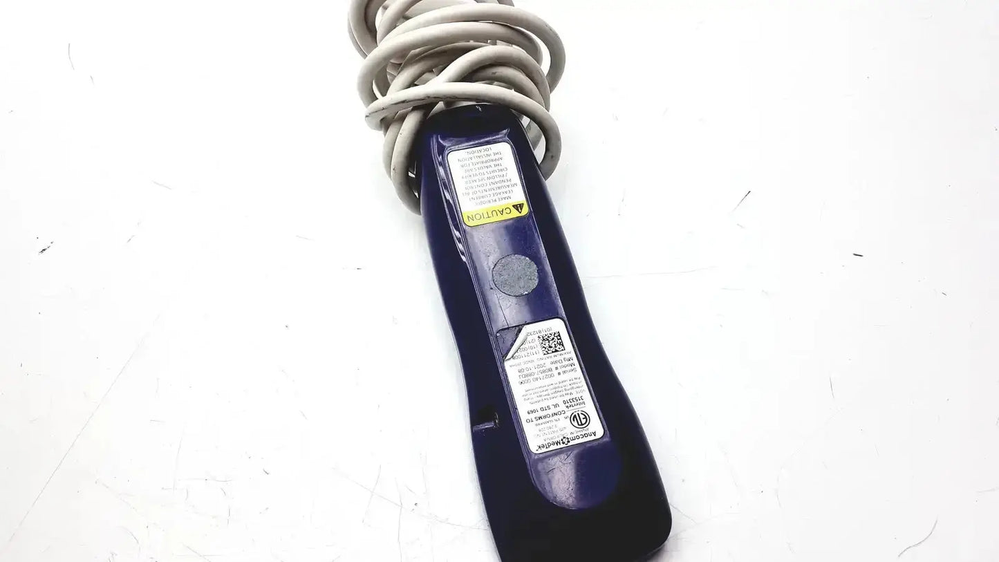 Dark blue plastic anacom medtek b0857-088dj nurse call unit remote control with coiled gray cord wrapped around handle