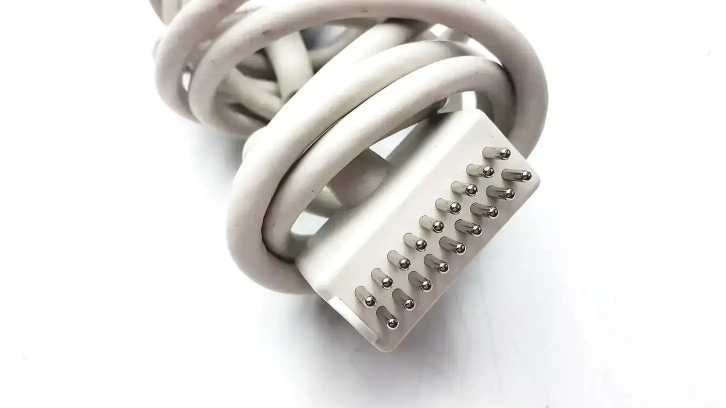 White coiled cable with rectangular multi-pin connector for the anacom medtek b0857-088dj nurse call unit back side