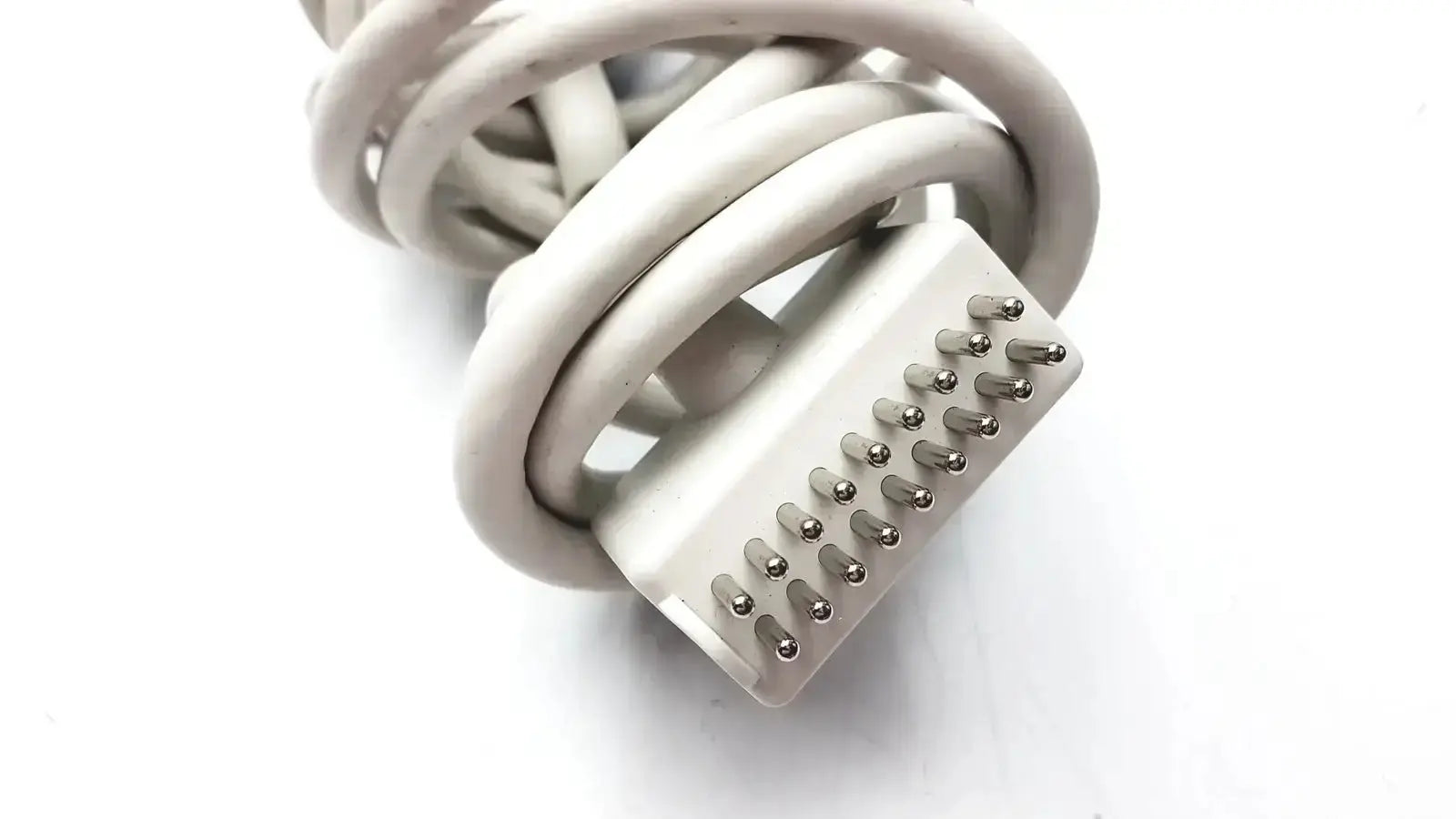 White coiled cable with rectangular multi-pin connector for the anacom medtek b0857-088dj nurse call unit back side