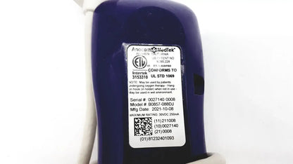 Dark blue cylindrical medical oxygen concentrator with white label showing model and serial number anacom medtek b0857-088dj nurse call unit