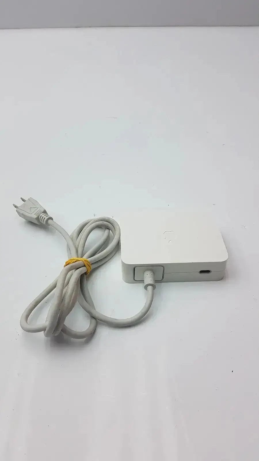 White rectangular 90w power adapter with coiled gray cable for apple cinema hd display model a1097