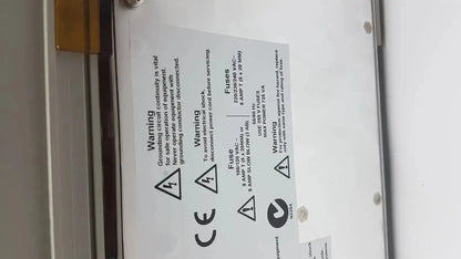 White label with black printed text and warnings on the back of applied biosystem geneamp pcr system 9700 thermal cycler