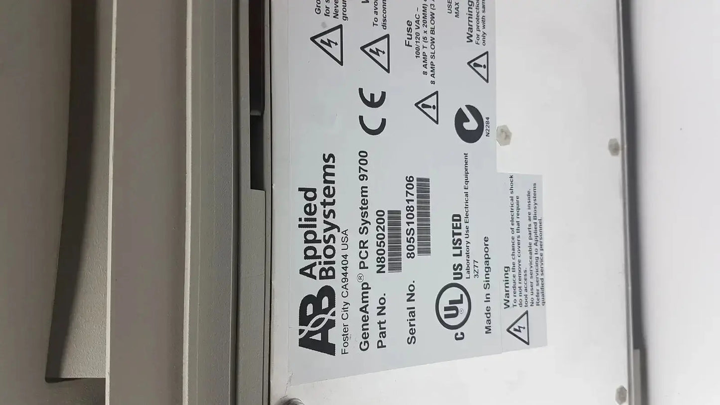 Applied biosystem geneamp pcr system 9700 is a white thermal cycler with black labeling and certification marks for lab use