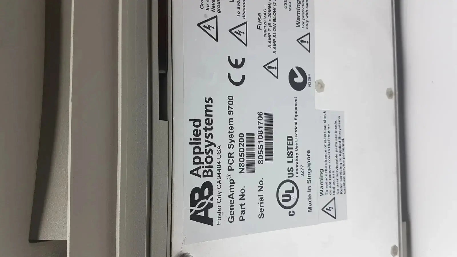 Applied biosystem geneamp pcr system 9700 is a white thermal cycler with black labeling and certification marks for lab use