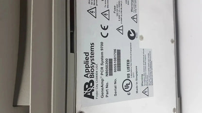 Applied biosystem geneamp pcr system 9700 is a white thermal cycler with black labeling and certification marks for lab use