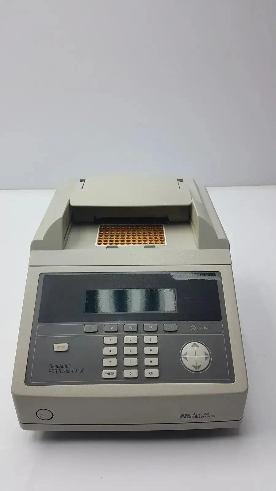 Beige rectangular applied biosystem geneamp thermal cycler with digital display and keypad for pcr amplification