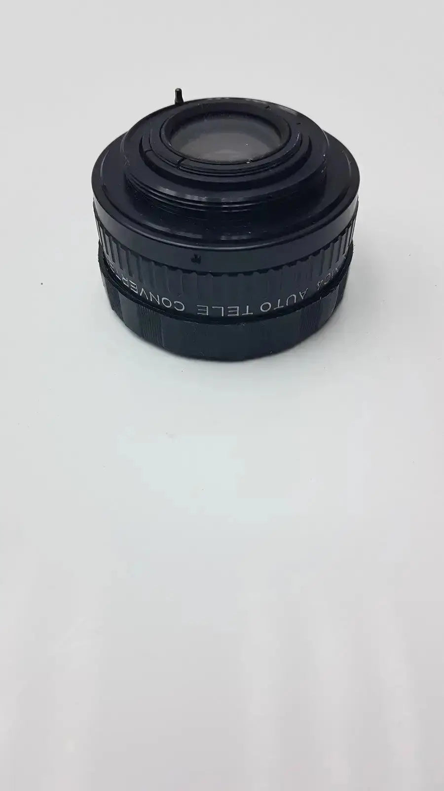 Black plastic APS Rokunar 2x MC4 auto tele converter lens with engraved text on barrel for photography use