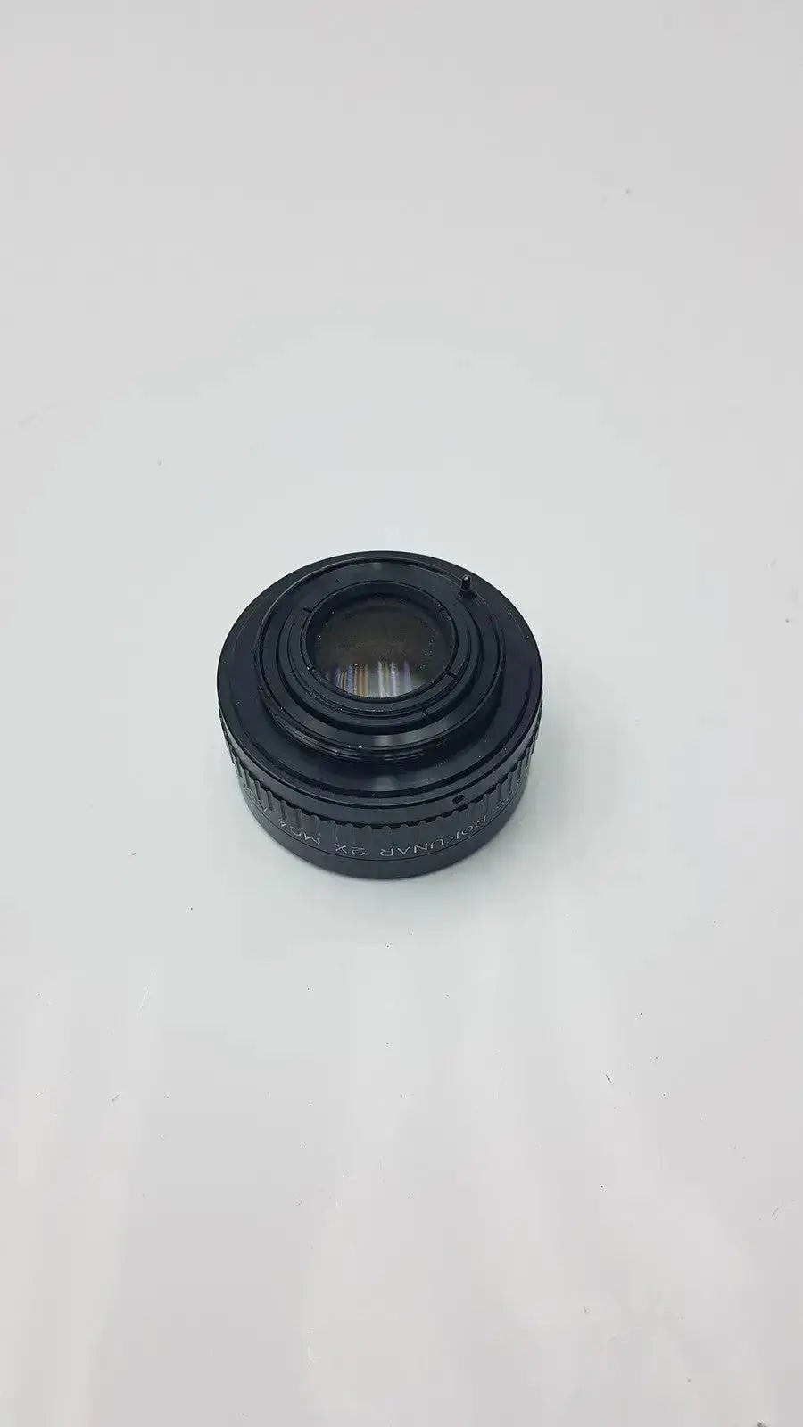 Black circular rokunar 2x mc4 auto tele converter lens adapter with textured grip ring and engraved markings