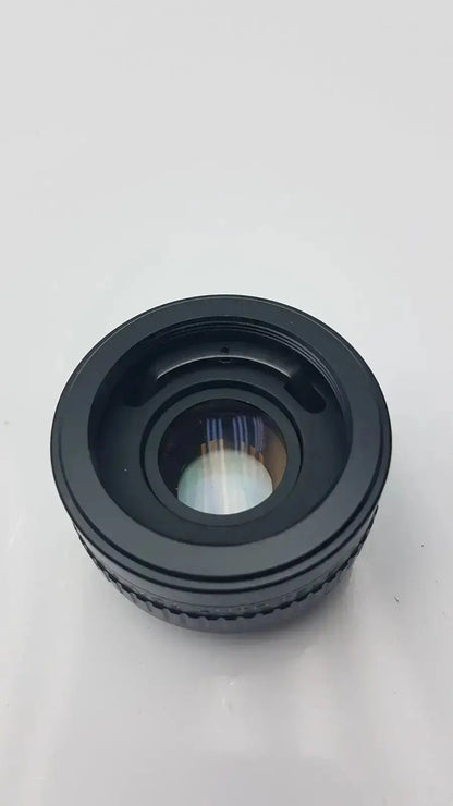 Black circular rokunar 2x mc4 auto tele converter lens adapter with textured ridges and reflective glass element