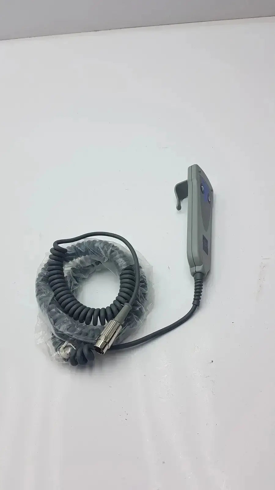 Gray arjo 2 button function handset with coiled black cable and metallic connector g-bbde2-30t used medical equipment for sale
