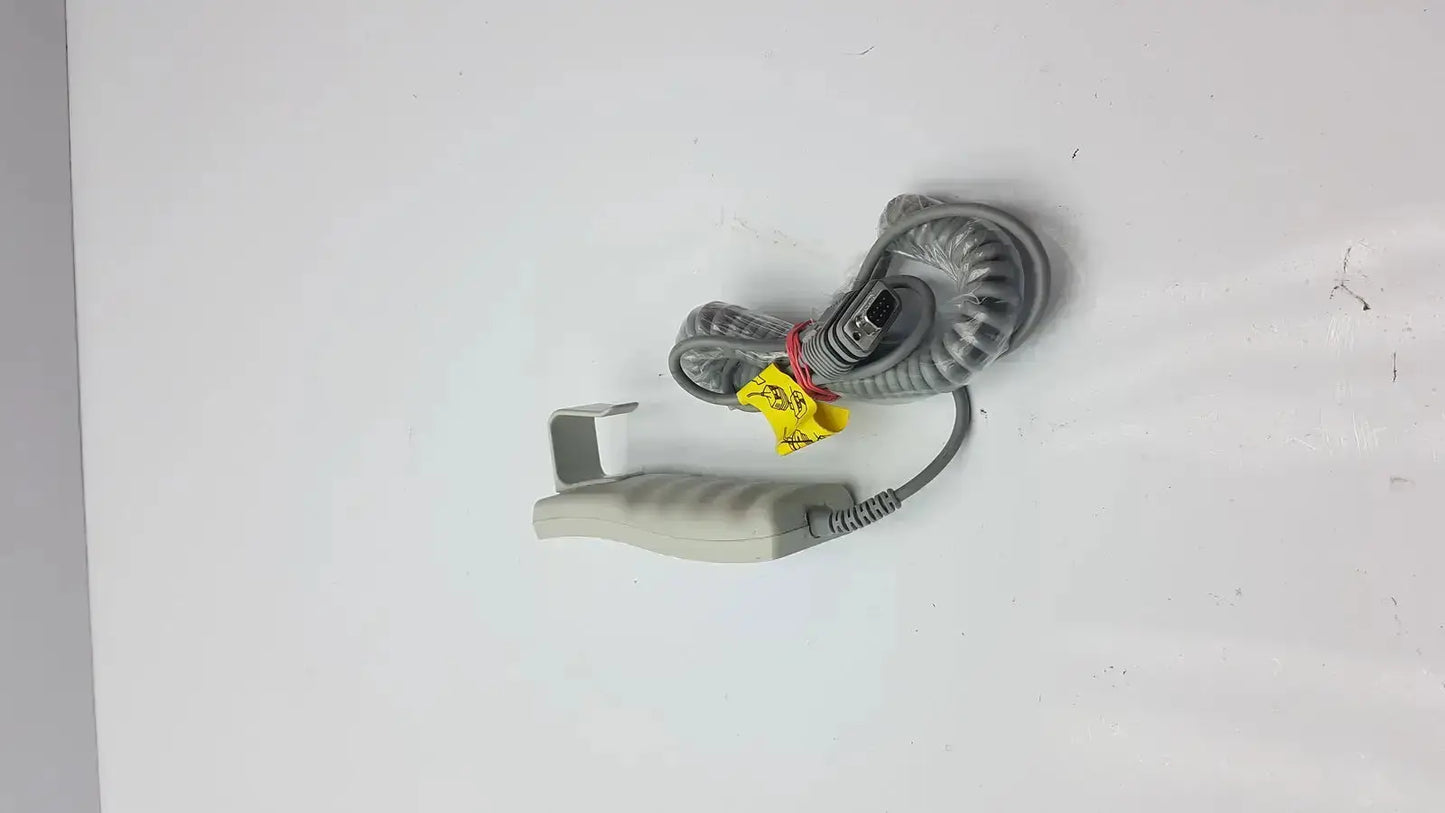 Gray coiled cable with beige handheld grip and yellow warning tags for arjo huntleigh patient lift remote handset