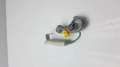 Gray coiled cable with beige handheld grip and yellow warning tags for arjo huntleigh patient lift remote handset