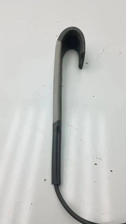 Black and silver hook-shaped earbud charging case with sleek curved design for arjo huntleigh patient lift remote controller