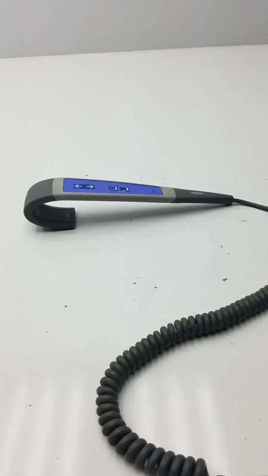 Gray and blue wired remote handset controller with coiled black cable for arjo huntleigh patient lift use