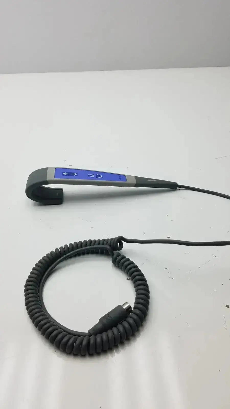 Gray and blue ergonomic patient lift wired remote handset controller with coiled black cable for Arjo Huntleigh patient lift