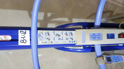 Blue hospital bed with control panel and instructional diagrams on the arjo maxi power patient lift handset 700-19326
