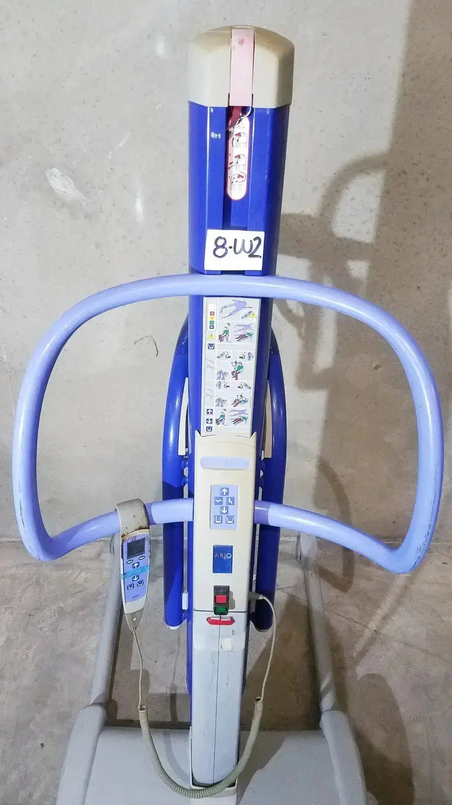 Arjo maxi blue and white power patient lift with curved handles, control panel, and digital display for safe transfers