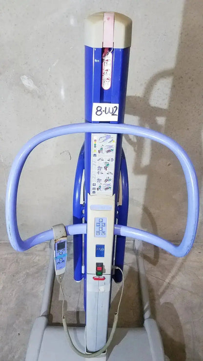Arjo maxi blue and white power patient lift with curved handles, control panel, and digital display for safe transfers