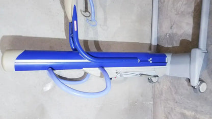 Blue and white arjo maxi power patient lift with adjustable height mechanism for safe patient transfer