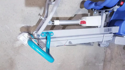 Blue and gray arjo sara 3000 hospital mobile patient standing raising lift with turquoise handle for patient assistance