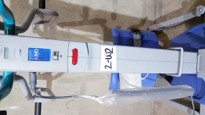 White arjo sara 3000 hospital mobile patient standing raising lift aid with blue and red control buttons on blue panel