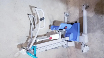 Blue and white arjo sara 3000 hospital mobile patient lift chair with adjustable armrests and standing raising feature