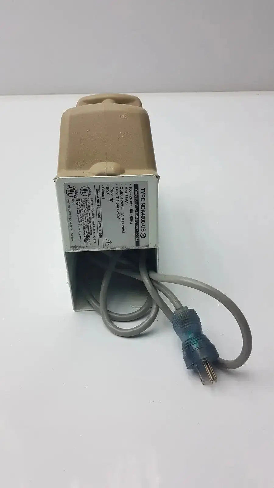 Beige plastic arjo type nda4000-us charger with gray power cord and blue connector input 24v dc 1a output