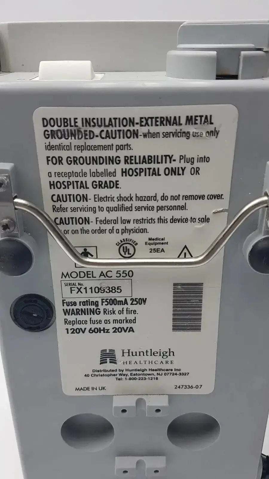 Gray plastic medical device arjohuntleigh flowtron excel model ac 550 with safety warnings and labeling visible