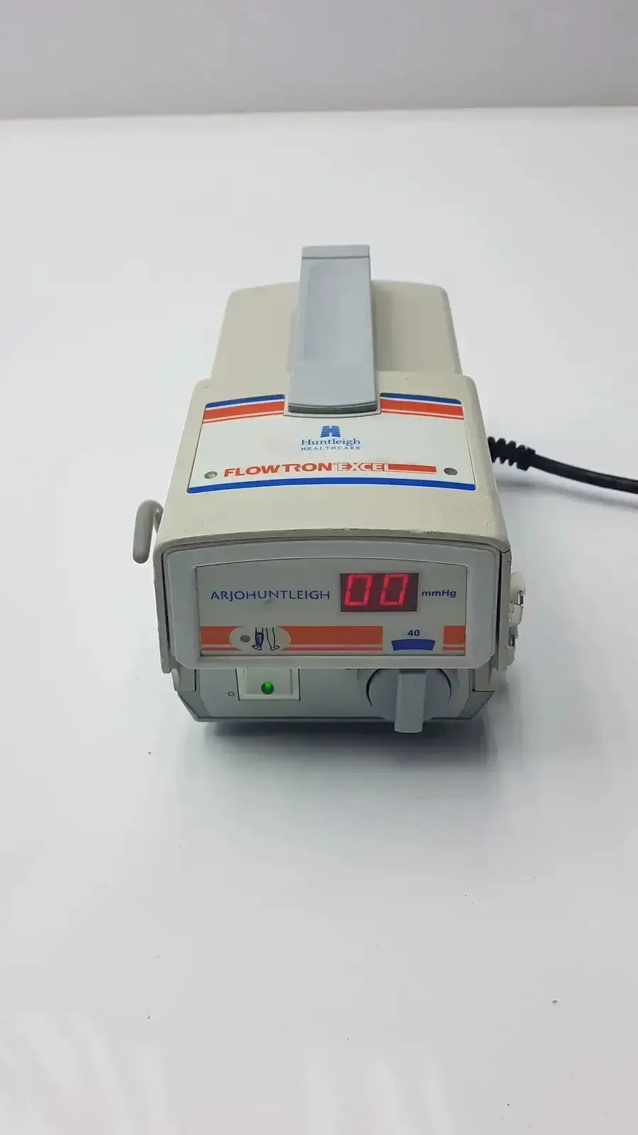 Beige and orange arjohuntleigh flowtron excel model ac 550 medical infusion pump with digital display and control panel