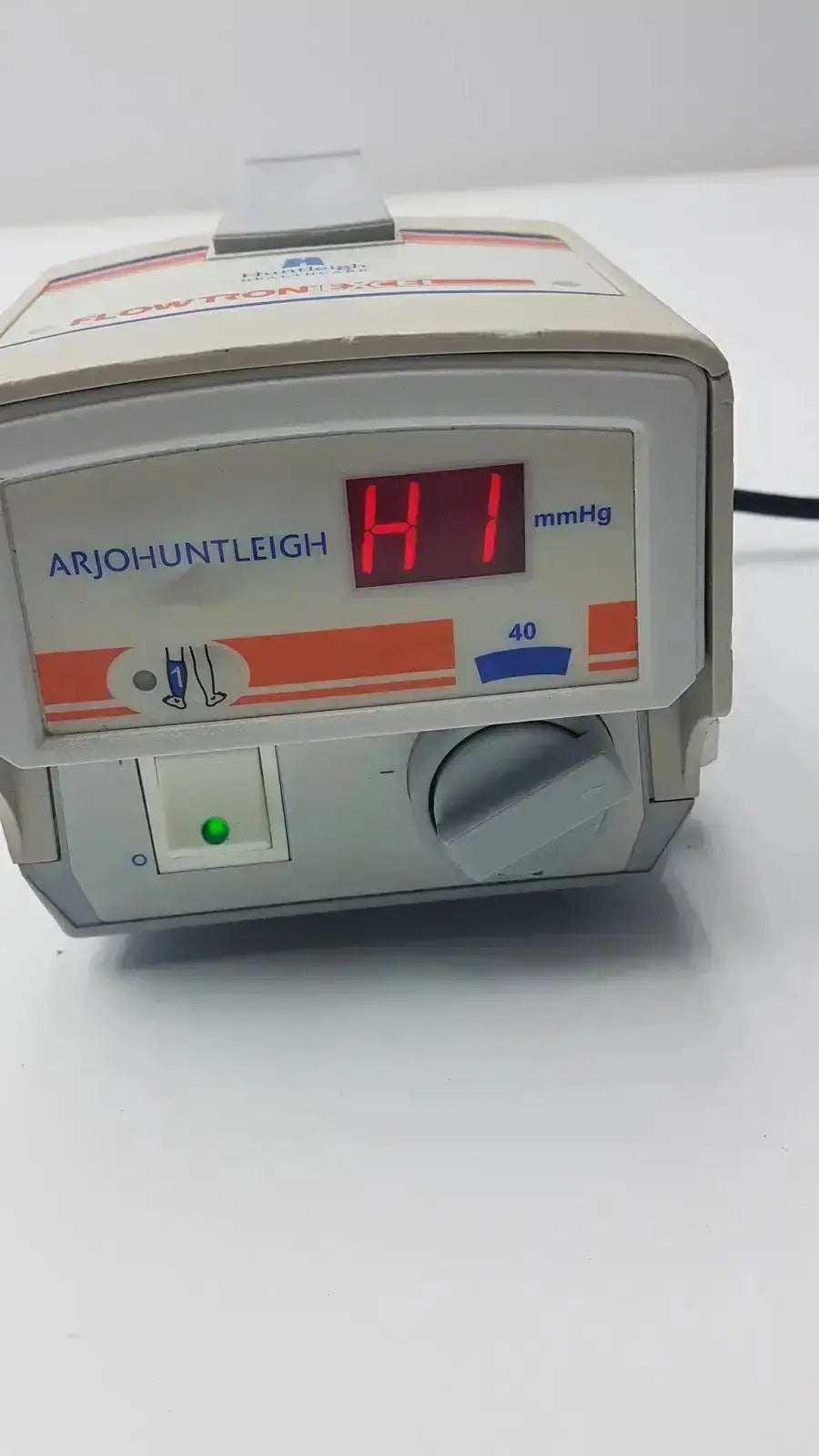 Beige arjohuntleigh flowtron excel model ac 550 blood pressure monitor with red digital display and green power indicator