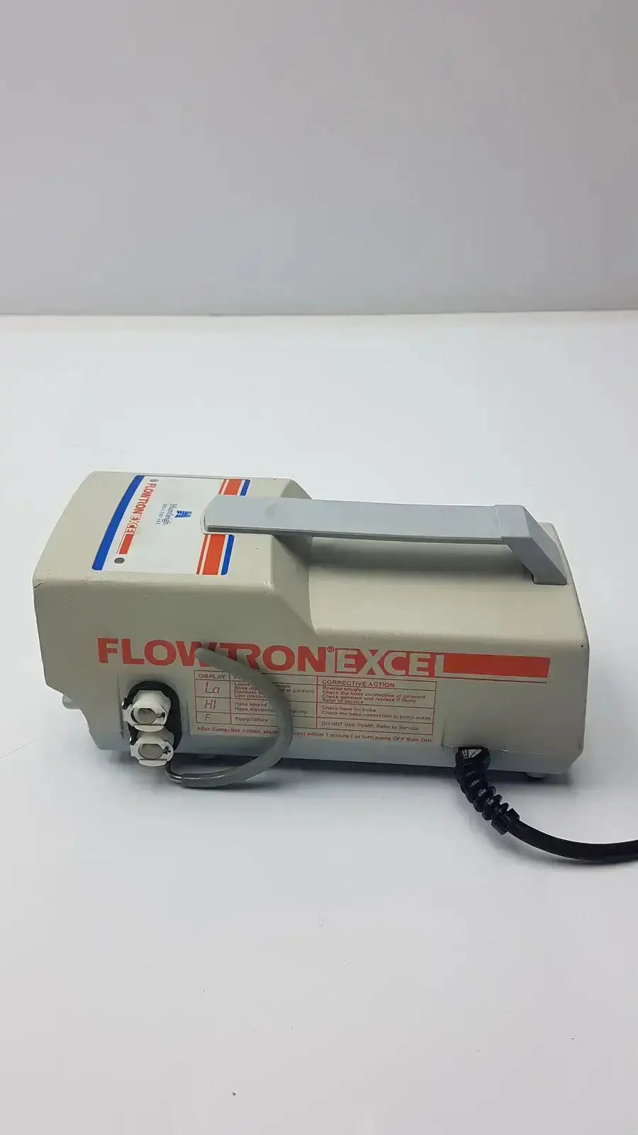Beige arjohuntleigh flowtron excel model ac 550 medical device with gray handle and black power cord