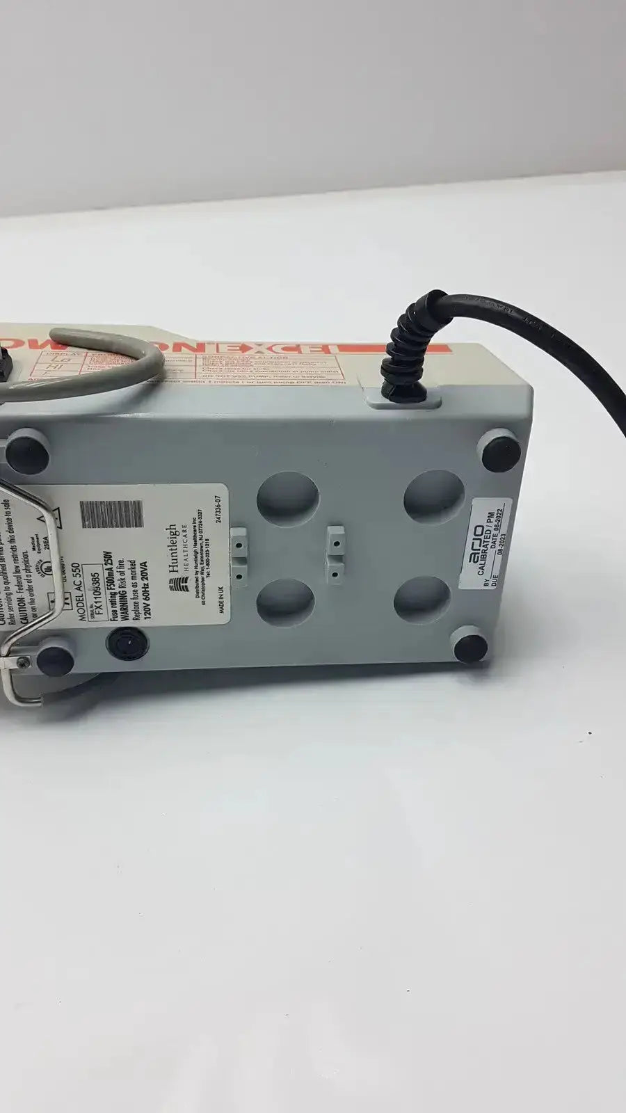 Gray plastic power strip with black coiled cord and circular ventilation holes for arjohuntleigh flowtron excel ac 550