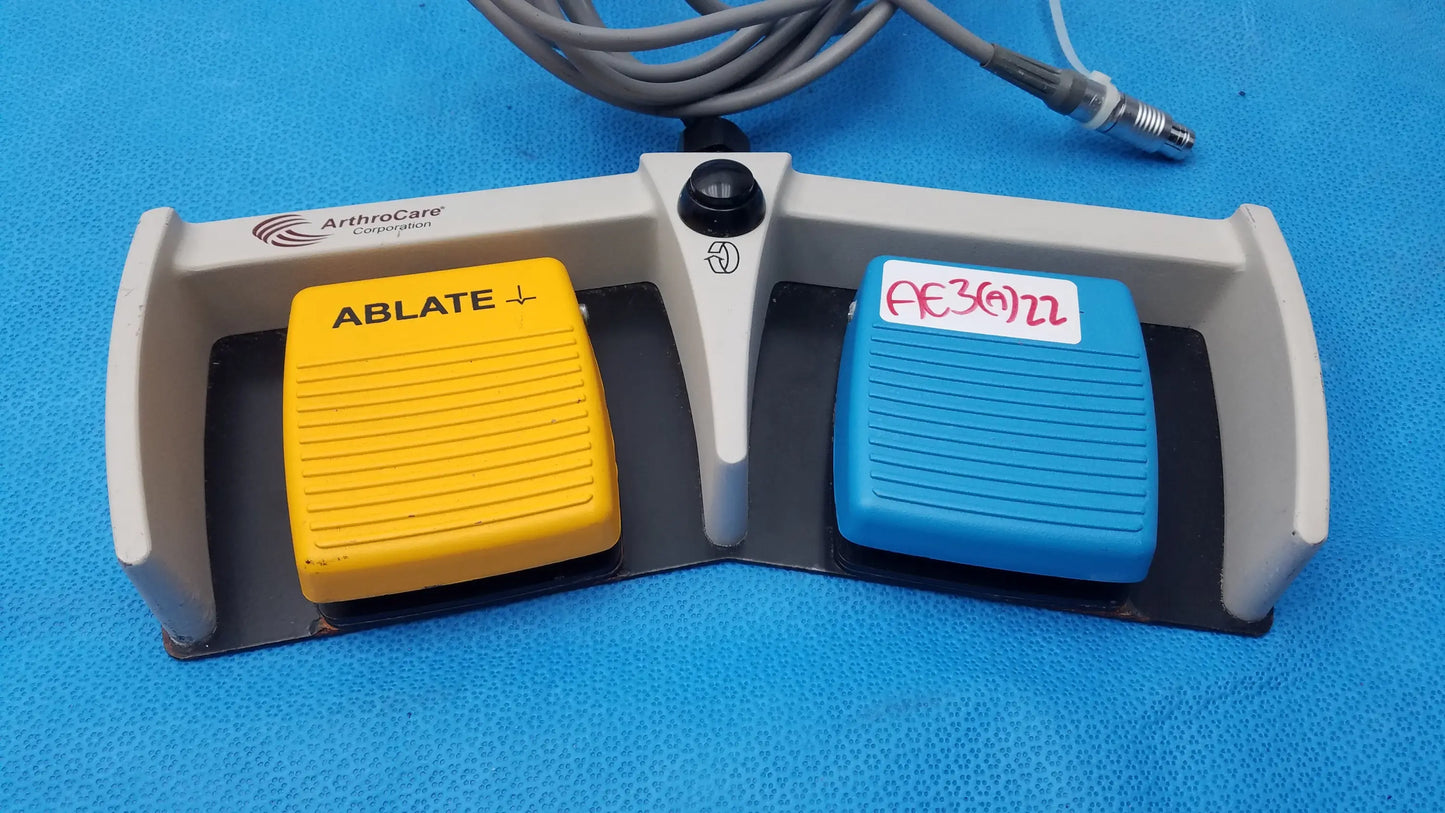 Gray ArthroCare 10863 dual footswitch pedal with yellow and blue dual-activated control pad for pre owned medical equipment